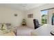 Bright bedroom with window, comfy couch, and workspace at 405 High Vista Dr, Davenport, FL 33837