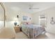 Bedroom with double bed, dresser, and ceiling fan at 405 High Vista Dr, Davenport, FL 33837