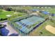 Aerial view of community tennis courts surrounded by palm trees at 405 High Vista Dr, Davenport, FL 33837