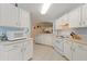 Bright kitchen with white cabinets, microwave, and stove at 405 High Vista Dr, Davenport, FL 33837