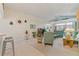 Spacious living room with teal couches and a high ceiling at 405 High Vista Dr, Davenport, FL 33837