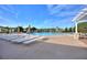 Relaxing pool deck area with lounge chairs and umbrellas at 405 High Vista Dr, Davenport, FL 33837