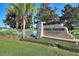 White Heron Golf Club sign with landscaping and a pond in the background at 405 High Vista Dr, Davenport, FL 33837