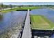Elevated walkway over water on a lush golf course at 405 High Vista Dr, Davenport, FL 33837