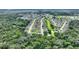 Aerial view showing home location in a neighborhood surrounded by trees at 405 High Vista Dr, Davenport, FL 33837