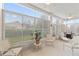 Relaxing sunroom with ample seating and sliding glass doors at 405 High Vista Dr, Davenport, FL 33837
