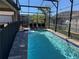 Screened-in pool and patio area at 185 Brookes Pl, Haines City, FL 33844