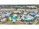 Aerial view of community pool, water park, and residential buildings at 185 Brookes Pl, Haines City, FL 33844