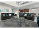 Open living room with two sofas and a view of the kitchen at 9032 Flamingo Key Way, Kissimmee, FL 34747