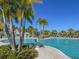 Enjoy this refreshing pool with palm trees and lounge chairs at 9032 Flamingo Key Way, Kissimmee, FL 34747