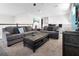 Spacious bonus room with comfortable seating and a coffee table at 9032 Flamingo Key Way, Kissimmee, FL 34747