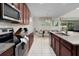 Modern kitchen with granite countertops and stainless steel appliances at 9032 Flamingo Key Way, Kissimmee, FL 34747