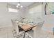 Modern dining room with a wood table and six chairs at 9032 Flamingo Key Way, Kissimmee, FL 34747