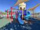 Modern playground with slides, climbing structures, and shade canopies at 9032 Flamingo Key Way, Kissimmee, FL 34747