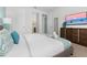 Main bedroom with king bed, large window, and ensuite bathroom access at 9032 Flamingo Key Way, Kissimmee, FL 34747