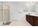 Bathroom with double vanity, large shower and neutral tile at 9032 Flamingo Key Way, Kissimmee, FL 34747