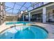Relaxing pool and spa with covered patio at 9032 Flamingo Key Way, Kissimmee, FL 34747