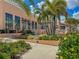 Community clubhouse with palm trees and landscaping at 9032 Flamingo Key Way, Kissimmee, FL 34747