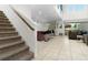 Carpeted staircase leading to upper level and kitchen at 9032 Flamingo Key Way, Kissimmee, FL 34747