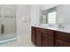Bathroom with single vanity, shower, and neutral decor at 9032 Flamingo Key Way, Kissimmee, FL 34747
