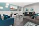 Bright living room with comfortable seating and large TV at 9032 Flamingo Key Way, Kissimmee, FL 34747