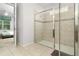 Large walk-in shower with glass enclosure and tile surround at 9032 Flamingo Key Way, Kissimmee, FL 34747