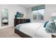 Main bedroom with king bed, window, and teal decor at 9032 Flamingo Key Way, Kissimmee, FL 34747