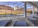 Enjoy this screened-in pool and spa with lounge chairs at 9032 Flamingo Key Way, Kissimmee, FL 34747