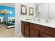 Shared bathroom with double vanity, connecting to bedroom at 9032 Flamingo Key Way, Kissimmee, FL 34747