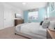 Main bedroom with king-size bed and ensuite bathroom at 9032 Flamingo Key Way, Kissimmee, FL 34747