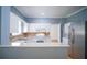 Efficient kitchen with white cabinets and granite countertops at 1501 Ne 57Th St, Ocala, FL 34479