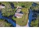 Aerial view of house, yard, and surrounding trees at 1501 Ne 57Th St, Ocala, FL 34479
