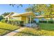 Ranch-style home with covered porch and well-maintained landscaping at 1501 Ne 57Th St, Ocala, FL 34479