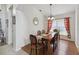 Bright dining room with wood floors and window seating at 241 Grosvenor Loop, Davenport, FL 33897