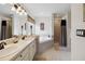 Main bathroom with double vanity, soaking tub, and shower at 241 Grosvenor Loop, Davenport, FL 33897