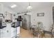 Kitchen with stainless steel appliances and breakfast bar at 241 Grosvenor Loop, Davenport, FL 33897