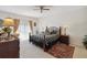 Main bedroom with ceiling fan and access to backyard at 241 Grosvenor Loop, Davenport, FL 33897