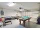 Finished garage converted to game room with pool table and foosball at 241 Grosvenor Loop, Davenport, FL 33897