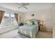 Bedroom with window, ceiling fan and dresser at 241 Grosvenor Loop, Davenport, FL 33897