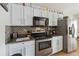 Well-equipped kitchen with stainless steel appliances at 241 Grosvenor Loop, Davenport, FL 33897