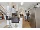 Kitchen boasts stainless steel appliances and granite countertops at 241 Grosvenor Loop, Davenport, FL 33897