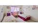 bedroom with twin beds and princess theme at 241 Grosvenor Loop, Davenport, FL 33897