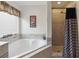 Bathroom with corner soaking tub and shower at 241 Grosvenor Loop, Davenport, FL 33897