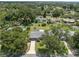 House nestled amongst lush trees in a quiet neighborhood at 3210 Carleton W Cir, Lakeland, FL 33803