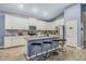 Modern kitchen with island, stainless steel appliances, and white cabinets at 6282 Lakepine St, St Cloud, FL 34771