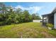 Large backyard with grassy area and screened enclosure at 6282 Lakepine St, St Cloud, FL 34771