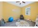 Bright bedroom with a ceiling fan and ample space for furniture at 6282 Lakepine St, St Cloud, FL 34771