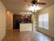 Kitchen features dark wood cabinets and breakfast bar at 909 Charo Pkwy # 1011, Davenport, FL 33897