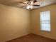 Well-lit bedroom featuring a ceiling fan and window blinds at 909 Charo Pkwy # 1011, Davenport, FL 33897