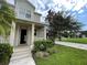 Two story house exterior with front porch and landscaping at 4980 W Castle W St, Kissimmee, FL 34758